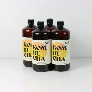 quatro garrafas de kombucha de gengibre da sõsu kombucha