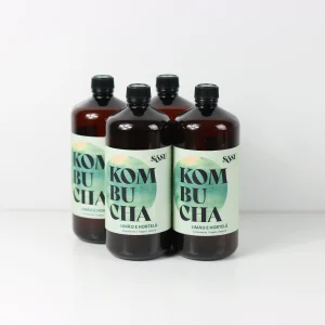 quatro garrafas de kombucha de limão hortelã da sõsu kombucha